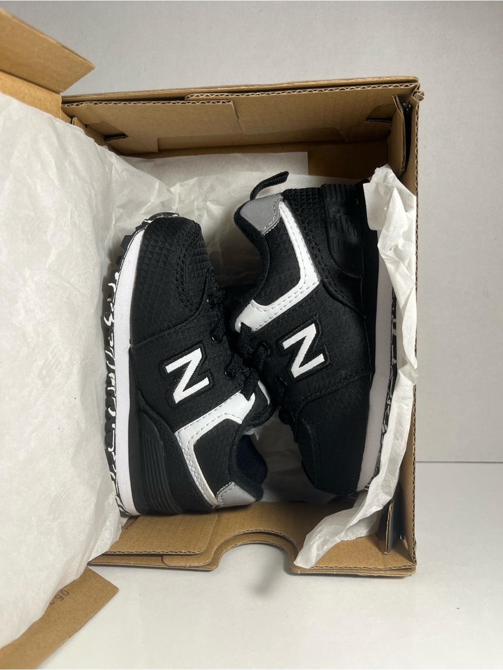 New Balance Kids Black and White Athletic Sneakers with 'N' Logo